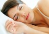 Cute young woman sleeping on the bed